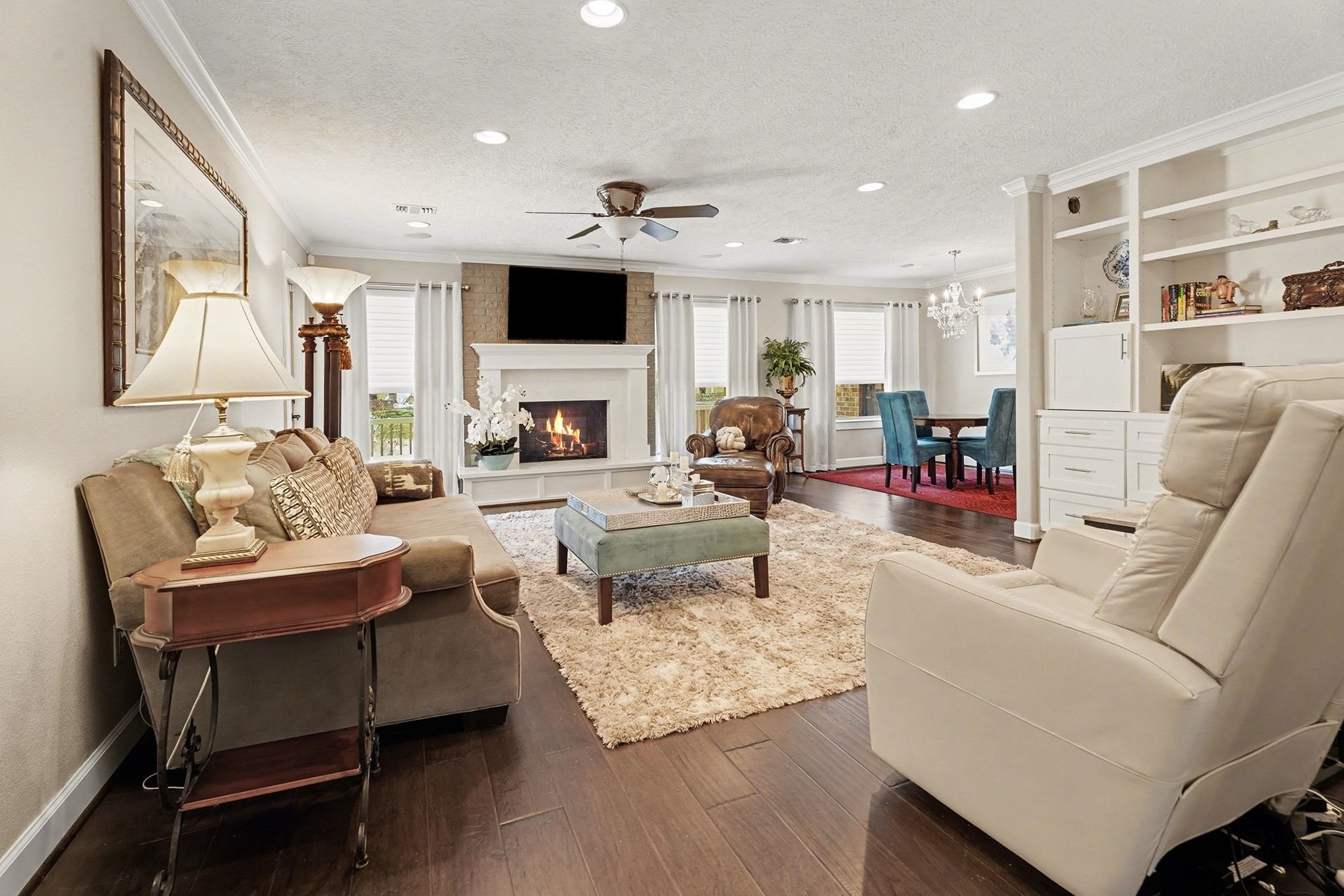 3409 Winter Lane Baytown, TX 77521 - Photo 14 of 44 a living room with fireplace furniture and a flat screen tv