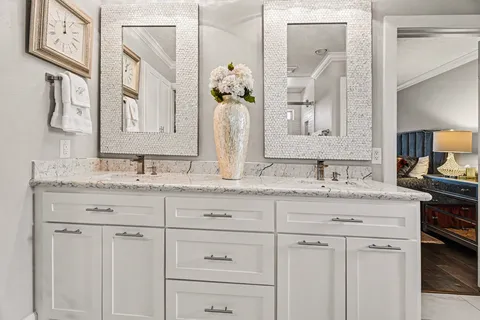 a bathroom with a shower and a glass door