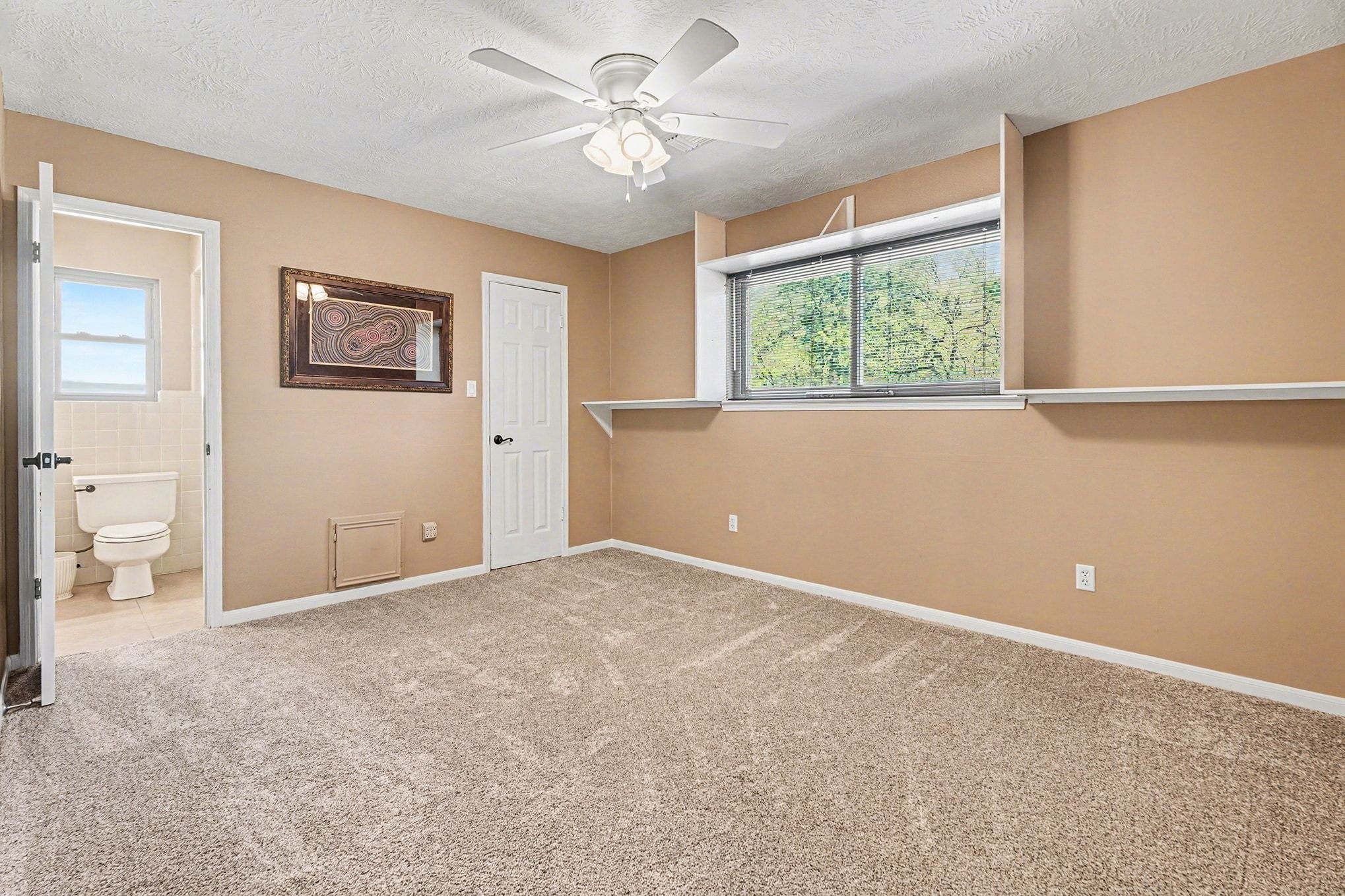 3409 Winter Lane Baytown, TX 77521 - Photo 26 of 44 an empty room with windows and fan