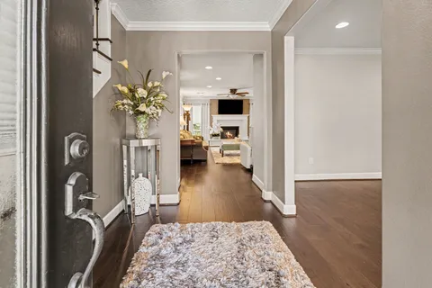 a view of dining room with furniture and wooden floor