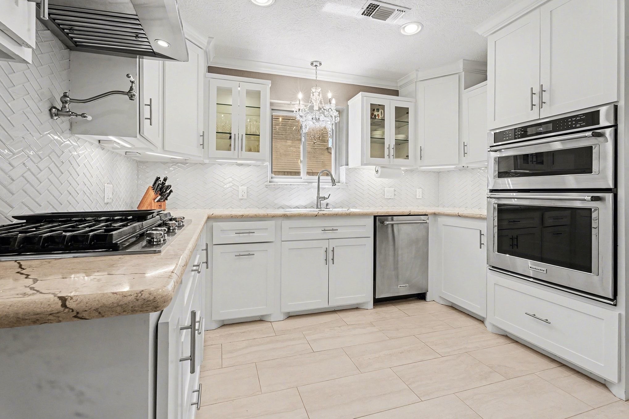 3409 Winter Lane Baytown, TX 77521 - Photo 10 of 44 a kitchen with a stove sink and a microwave
