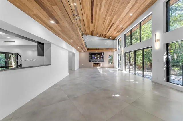 a bathroom with a tub sink shower and mirror