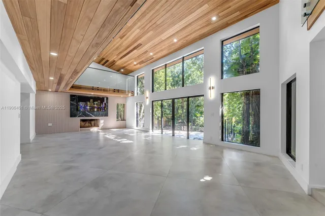 a spacious bathroom with a double vanity sink a mirror and a bathtub