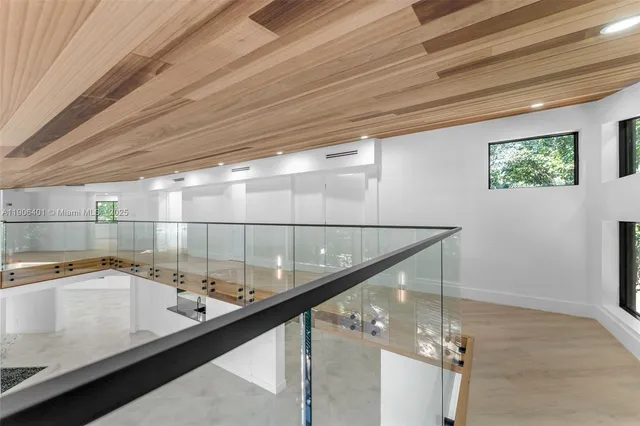 a view of a backyard with basketball court