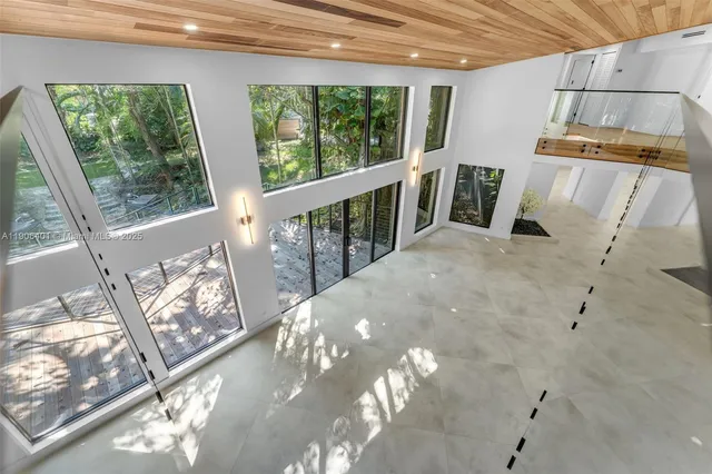a view of a balcony with wooden floor