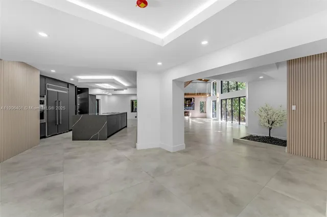 a large bathroom with a large mirror vanity and shower