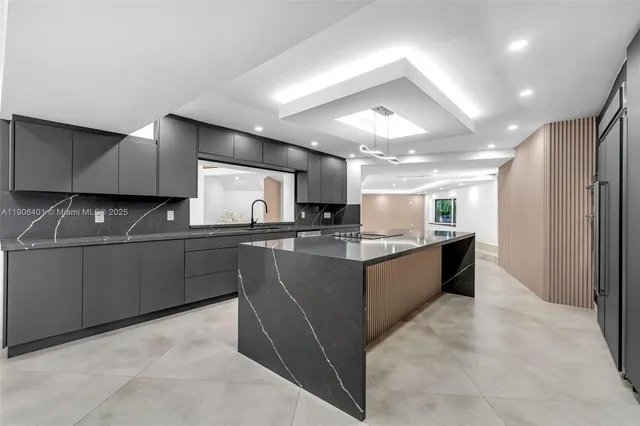 a view of an empty room with a floor to ceiling windows and yard