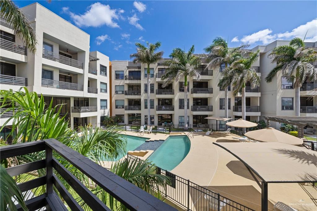 813 Travis Street, Unit 203 Mission, TX 78572 - Photo 17 of 30 a view of a house with swimming pool and sitting area
