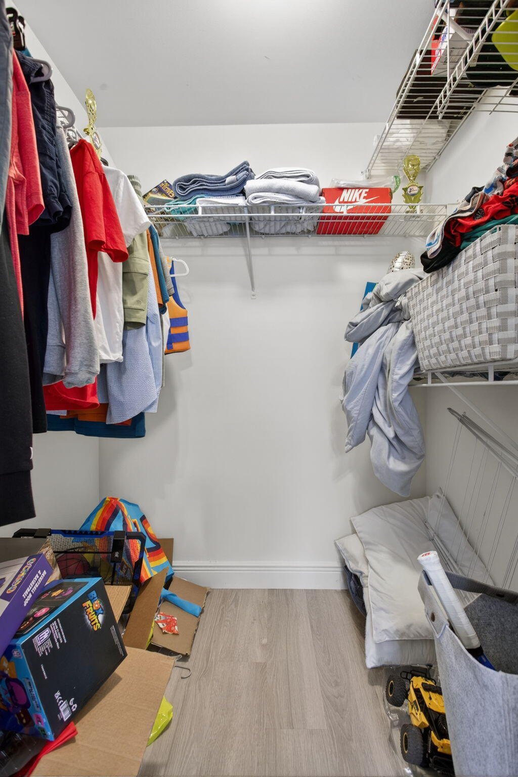 5880 West Sample Road, Unit 206 Coral Springs, FL 33067 - Photo 20 of 37 a view of walk in closet with clothes and shoes