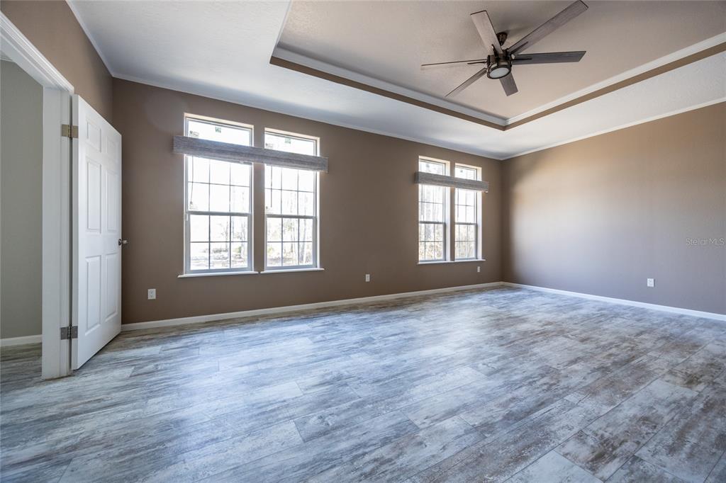 6671 Southwest 128th Lane Lake Butler, FL 32054 - Photo 29 of 66 a view of an empty room with a window and wooden floor