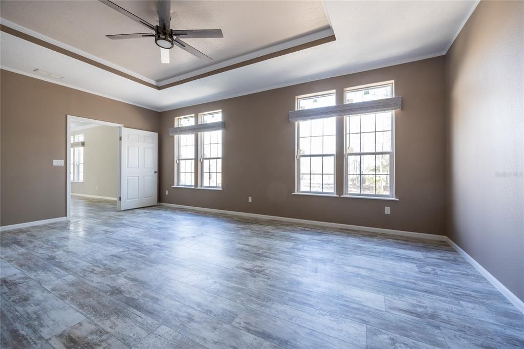 6671 Southwest 128th Lane Lake Butler, FL 32054 - Photo 30 of 66 a view of an empty room with a window and wooden floor