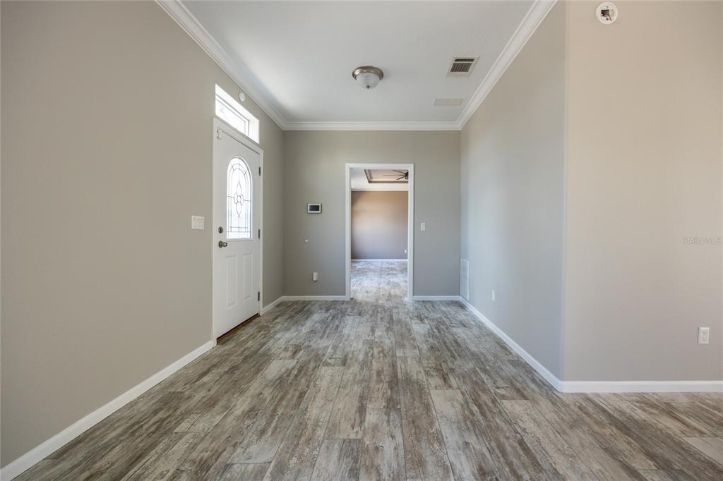 6671 Southwest 128th Lane Lake Butler, FL 32054 - Photo 3 of 66 a view of wooden floor and windows in a room