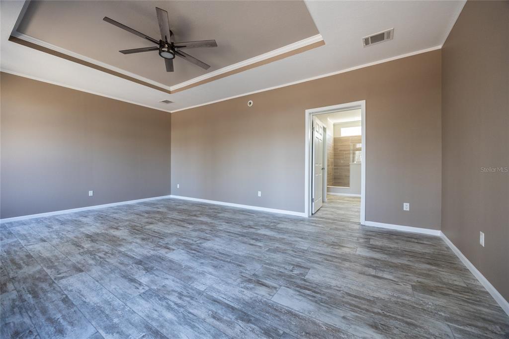 6671 Southwest 128th Lane Lake Butler, FL 32054 - Photo 32 of 66 a view of an empty room with a chandelier fan