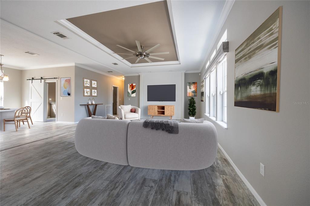 6671 Southwest 128th Lane Lake Butler, FL 32054 - Photo 4 of 66 a living room with furniture and a wooden floor