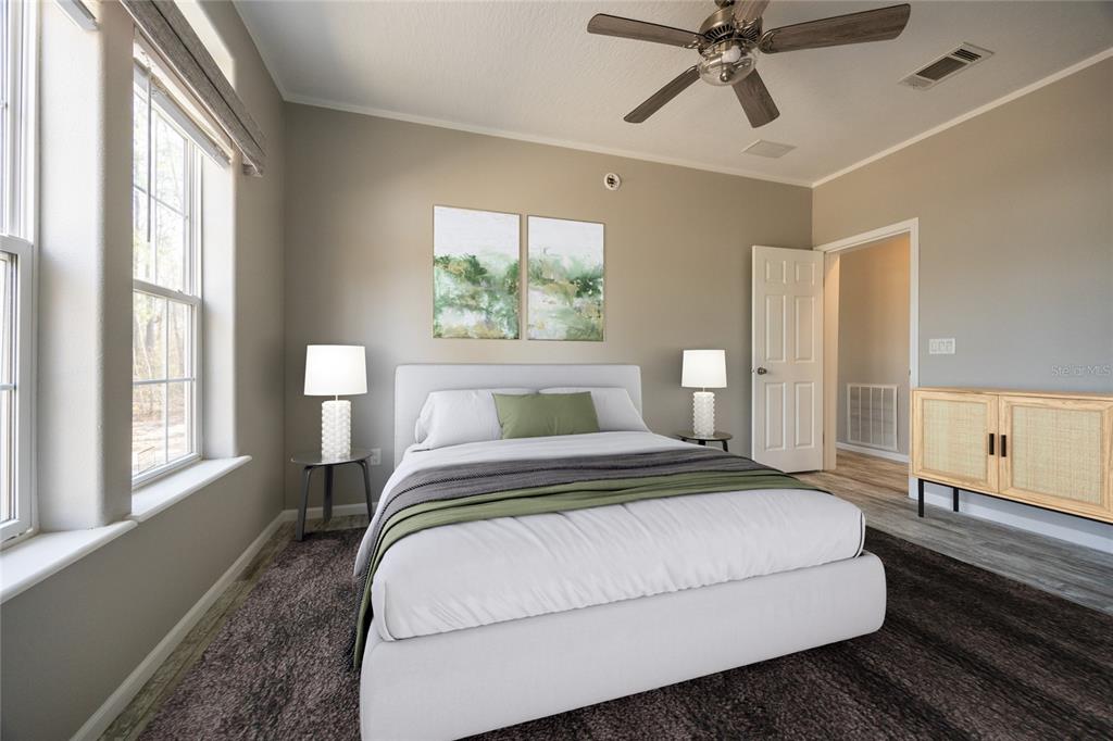 6671 Southwest 128th Lane Lake Butler, FL 32054 - Photo 42 of 66 a bedroom with a large bed and a window