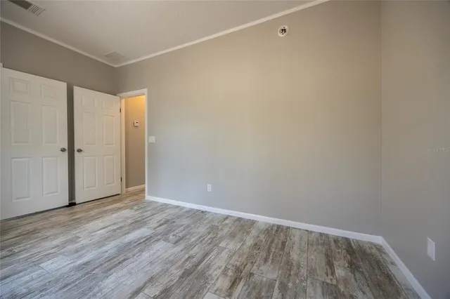 a view of an empty room with a window