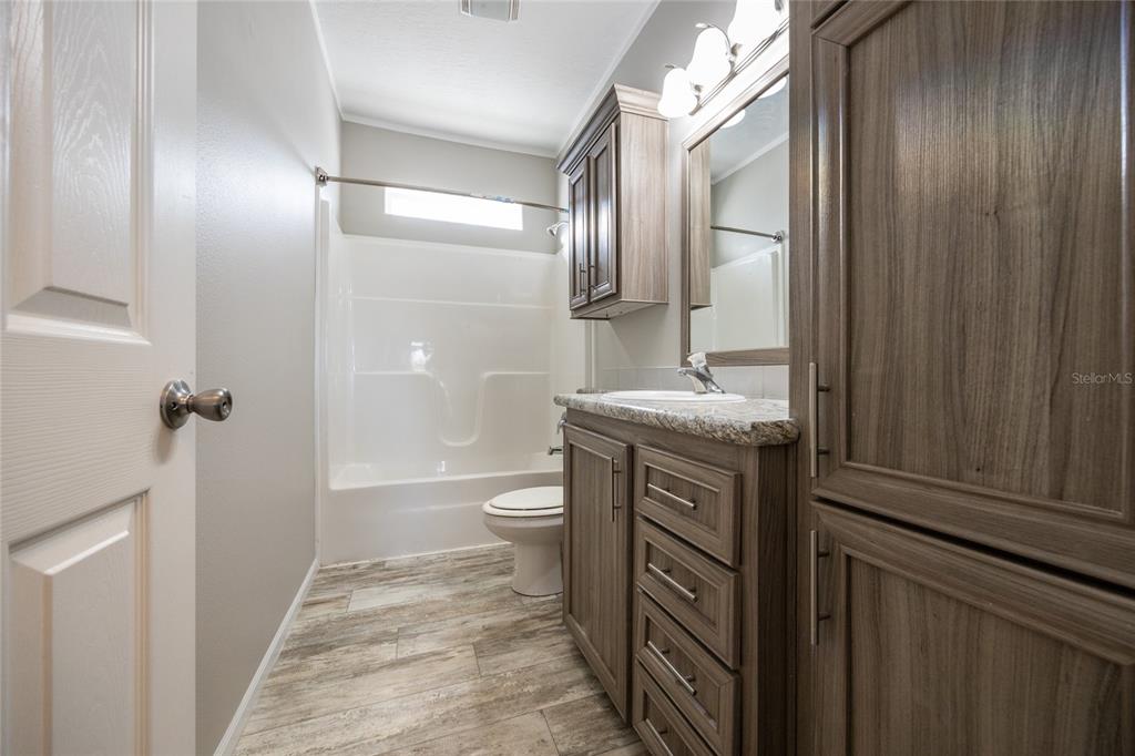 6671 Southwest 128th Lane Lake Butler, FL 32054 - Photo 50 of 66 a bathroom with a sink a toilet and shower