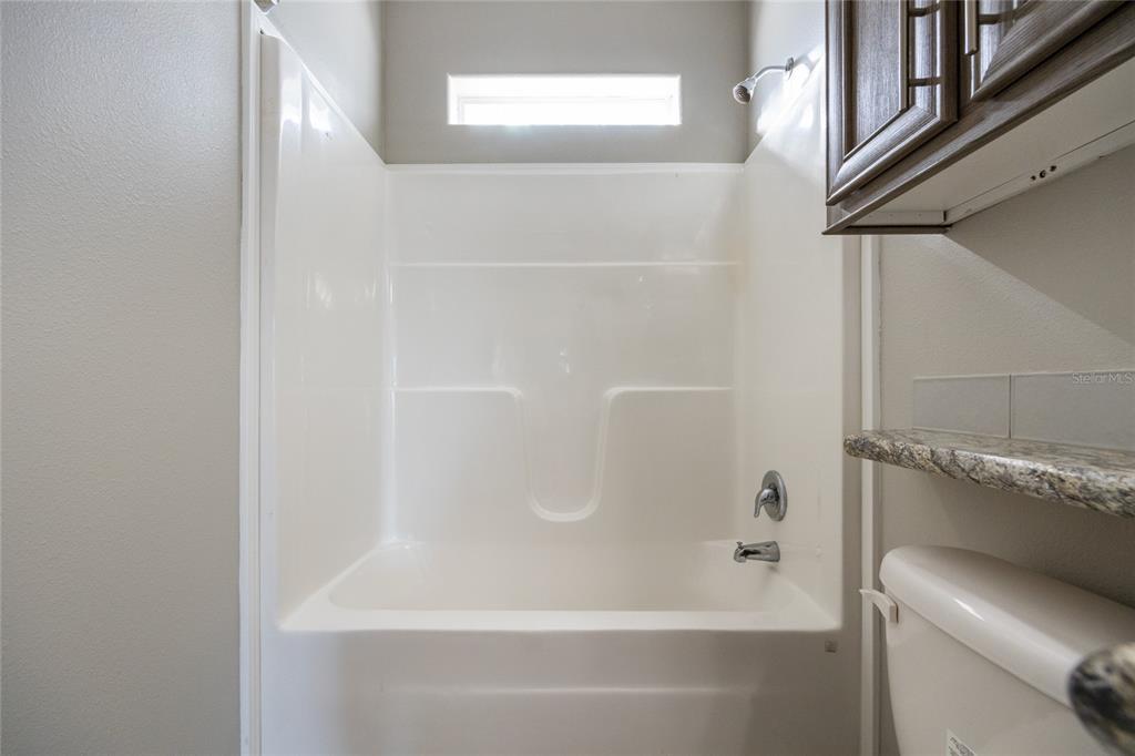 6671 Southwest 128th Lane Lake Butler, FL 32054 - Photo 51 of 66 a bathroom with a bathtub