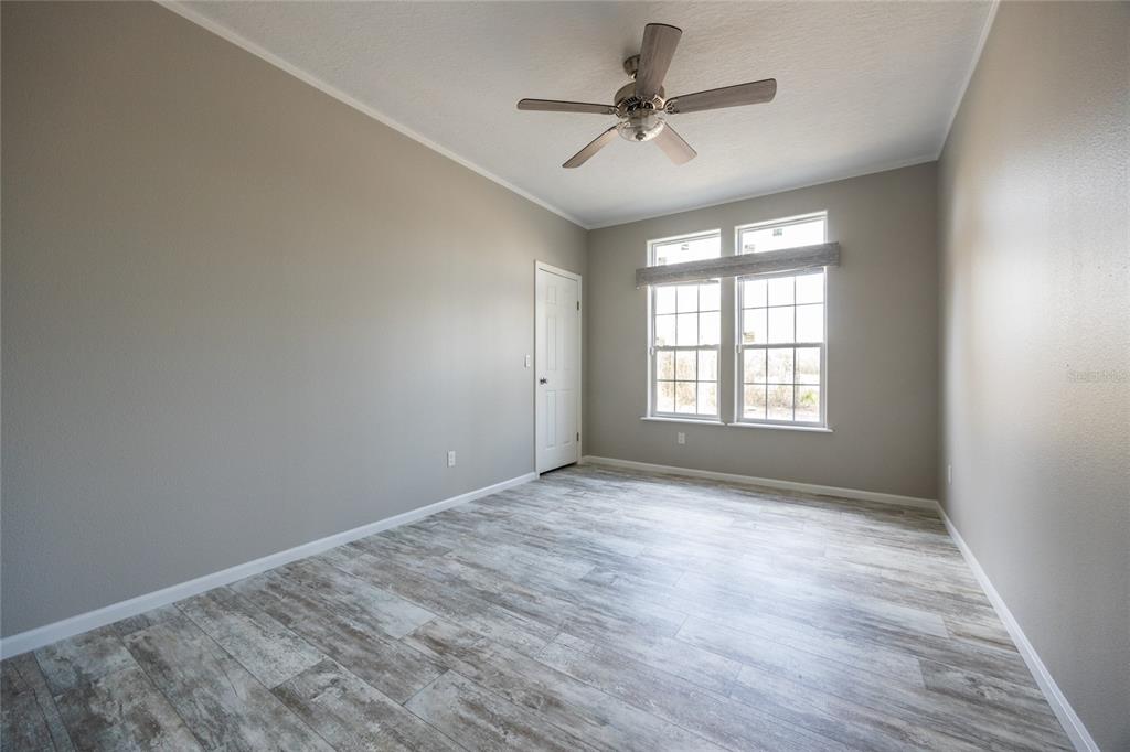 6671 Southwest 128th Lane Lake Butler, FL 32054 - Photo 54 of 66 wooden floor in an empty room with a window
