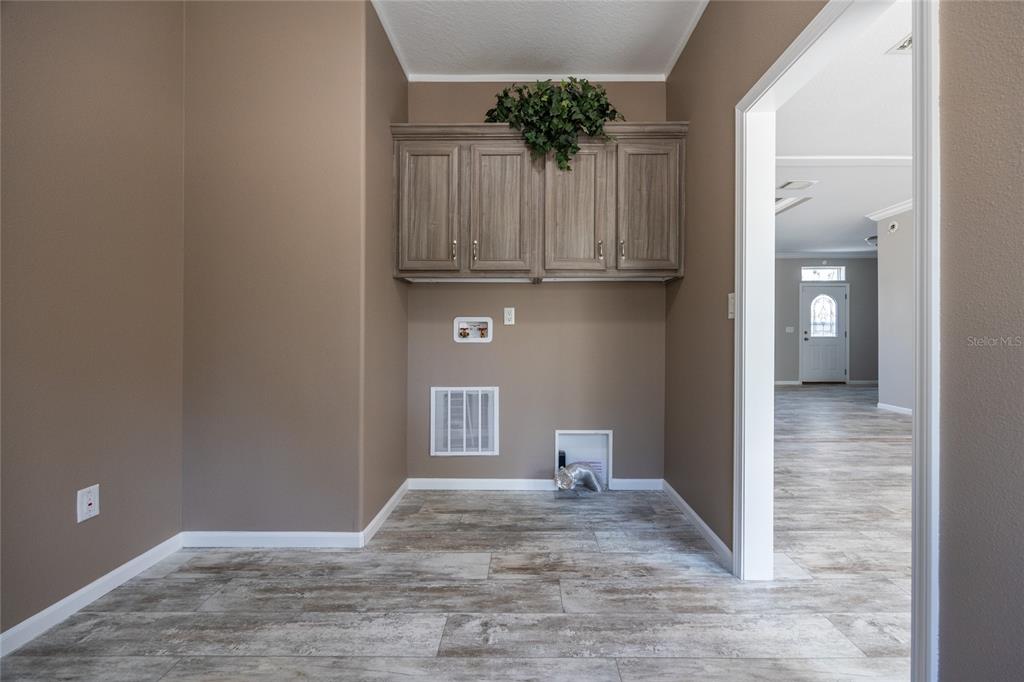 6671 Southwest 128th Lane Lake Butler, FL 32054 - Photo 59 of 66 a view of empty room with wooden floor and fan