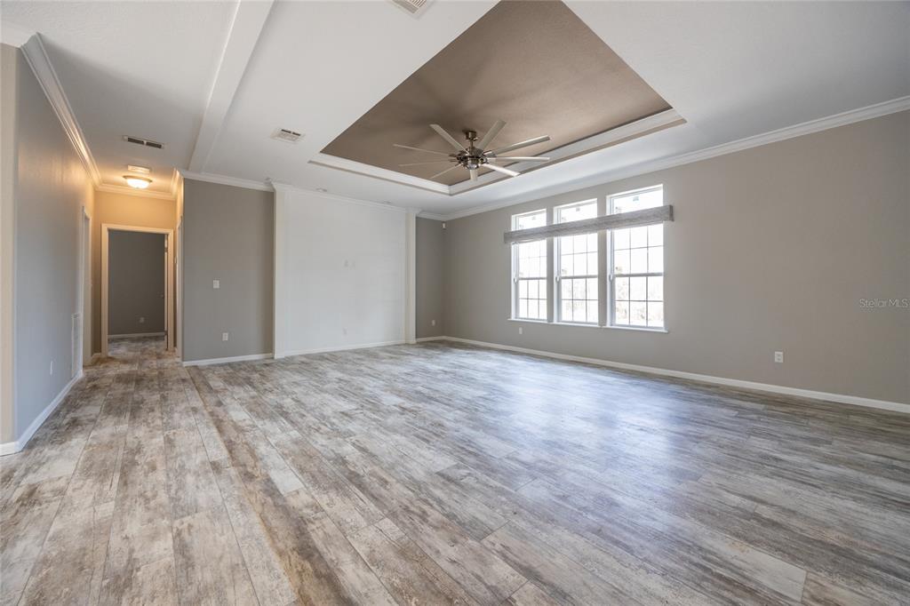 6671 Southwest 128th Lane Lake Butler, FL 32054 - Photo 9 of 66 a view of empty room with wooden floor and fan