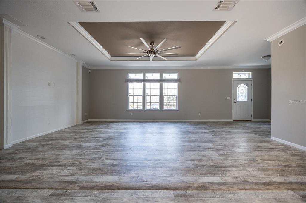 6671 Southwest 128th Lane Lake Butler, FL 32054 - Photo 10 of 66 wooden floor in an empty room with a window