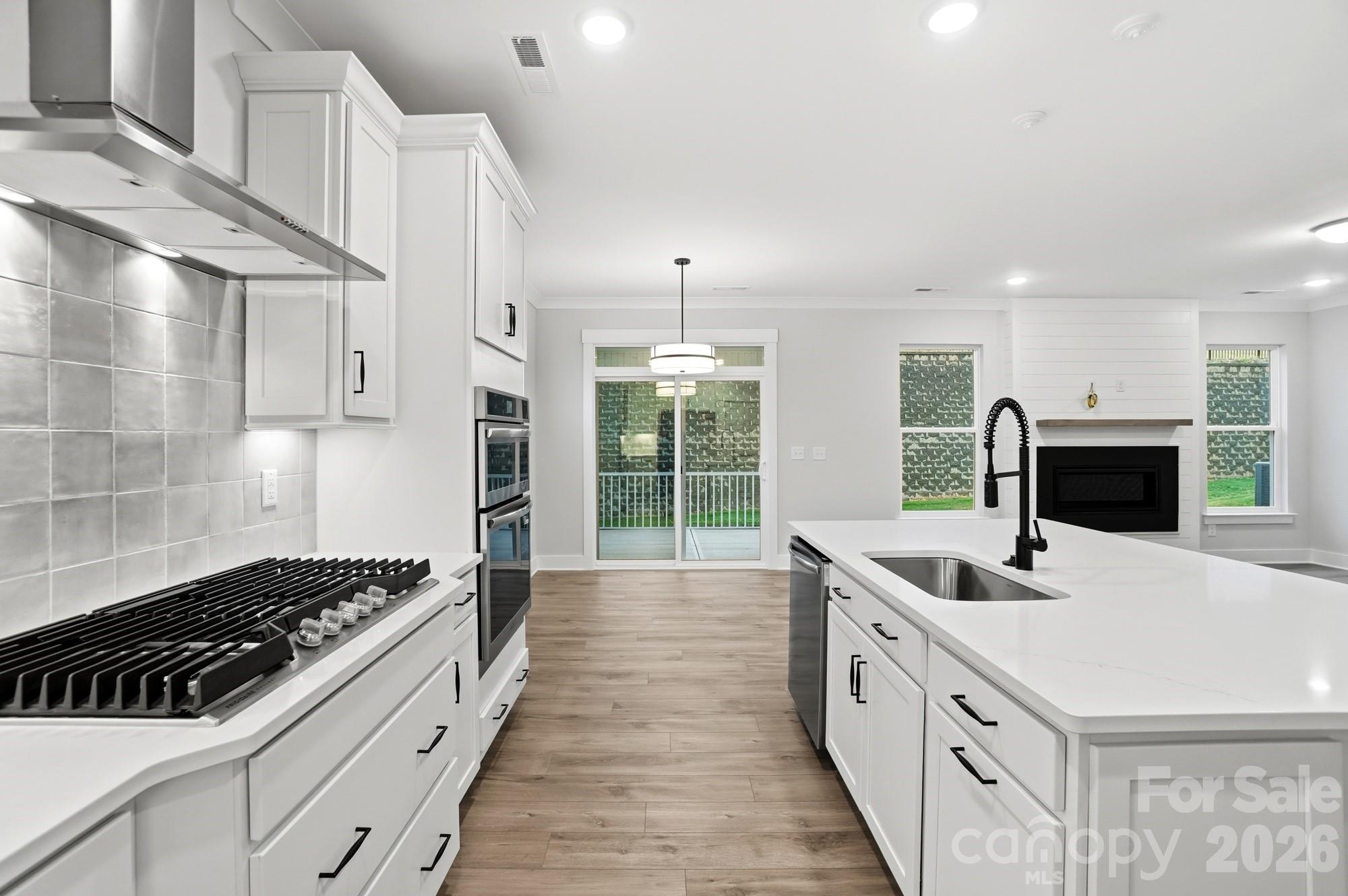 111 Longwood Road Mooresville, NC 28115 - Photo 11 of 47 a kitchen with sink stove and refrigerator