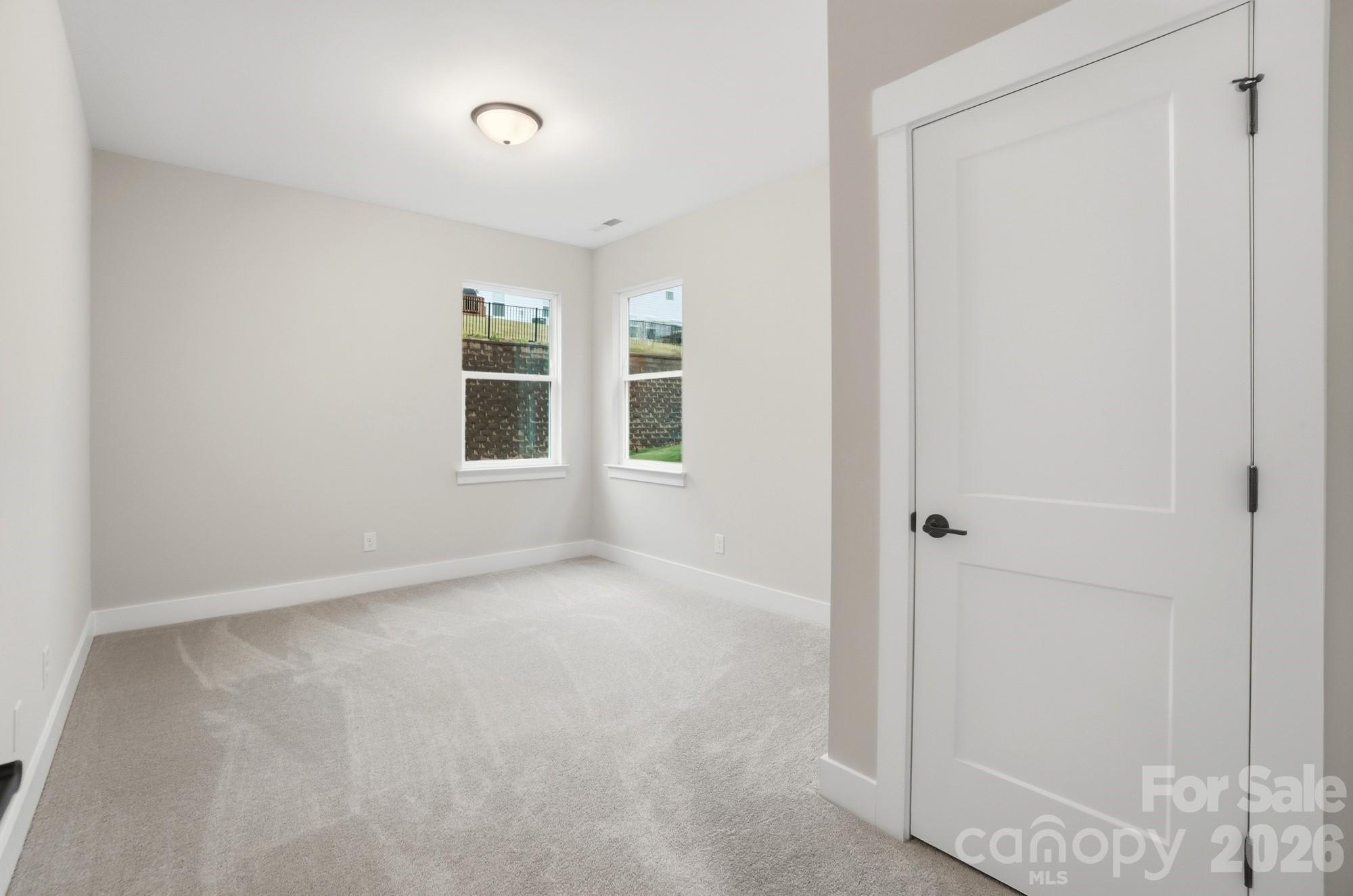 111 Longwood Road Mooresville, NC 28115 - Photo 18 of 47 a view of empty room with windows