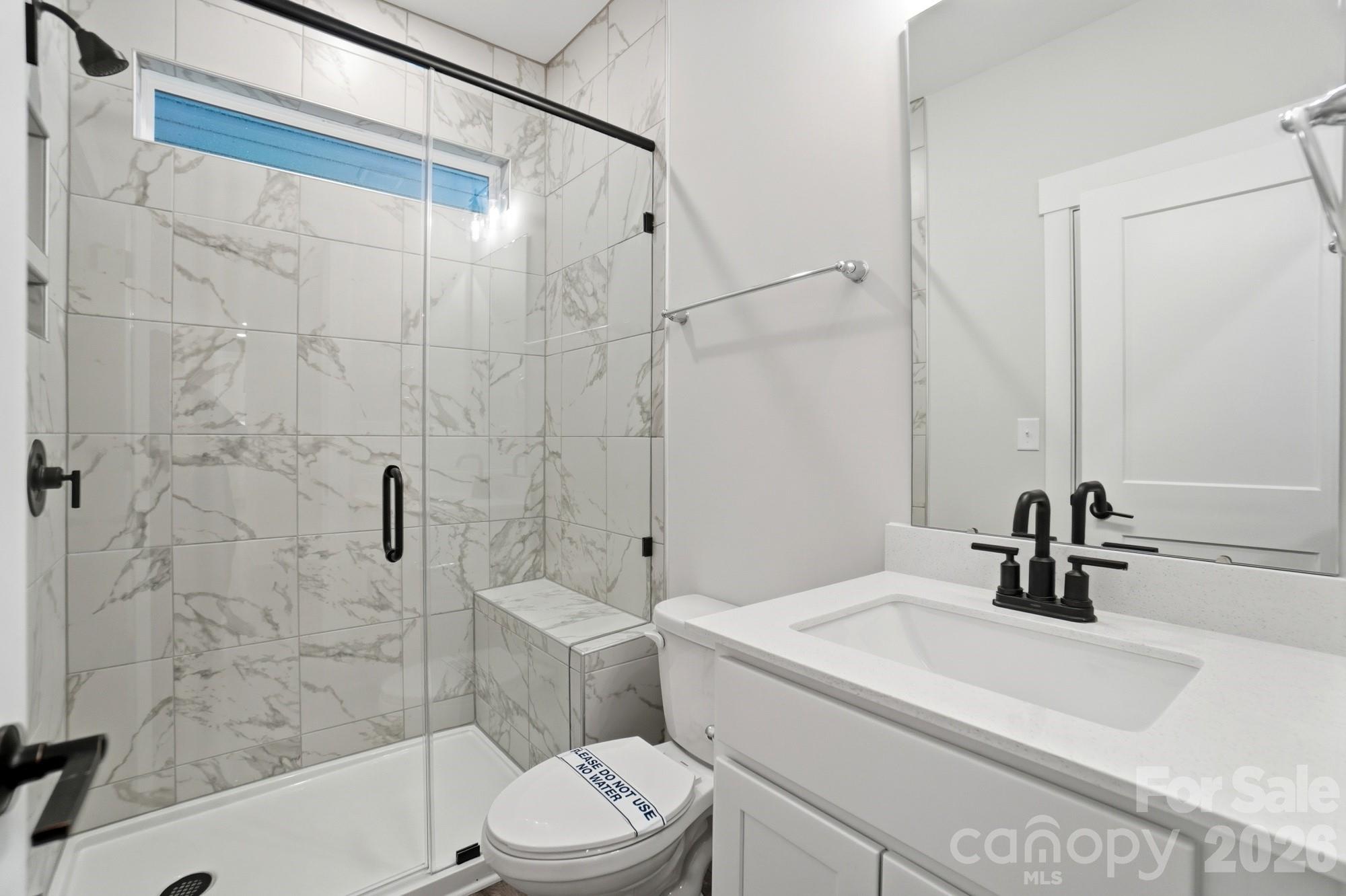 111 Longwood Road Mooresville, NC 28115 - Photo 20 of 47 a bathroom with a sink a toilet and shower