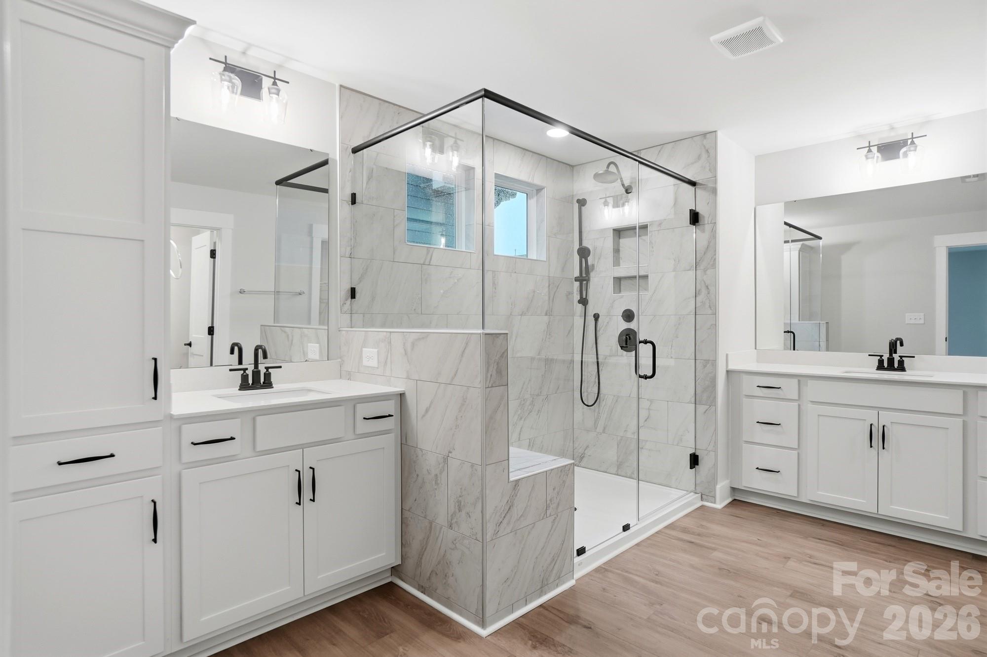 111 Longwood Road Mooresville, NC 28115 - Photo 26 of 47 a spacious bathroom with a shower sink double and mirror