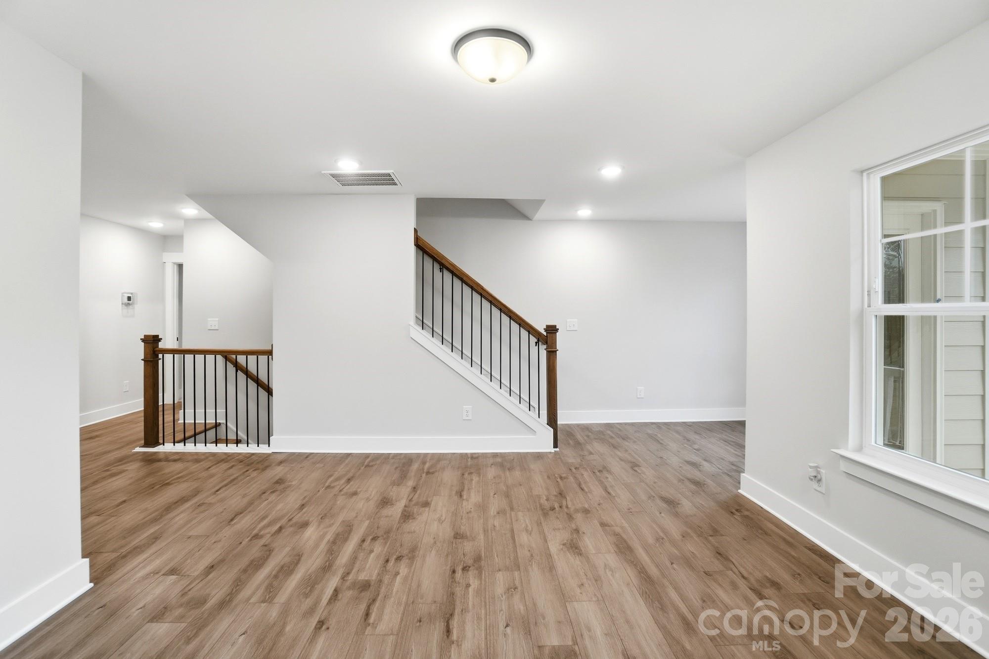 111 Longwood Road Mooresville, NC 28115 - Photo 36 of 47 a view of staircase with white walls and a window