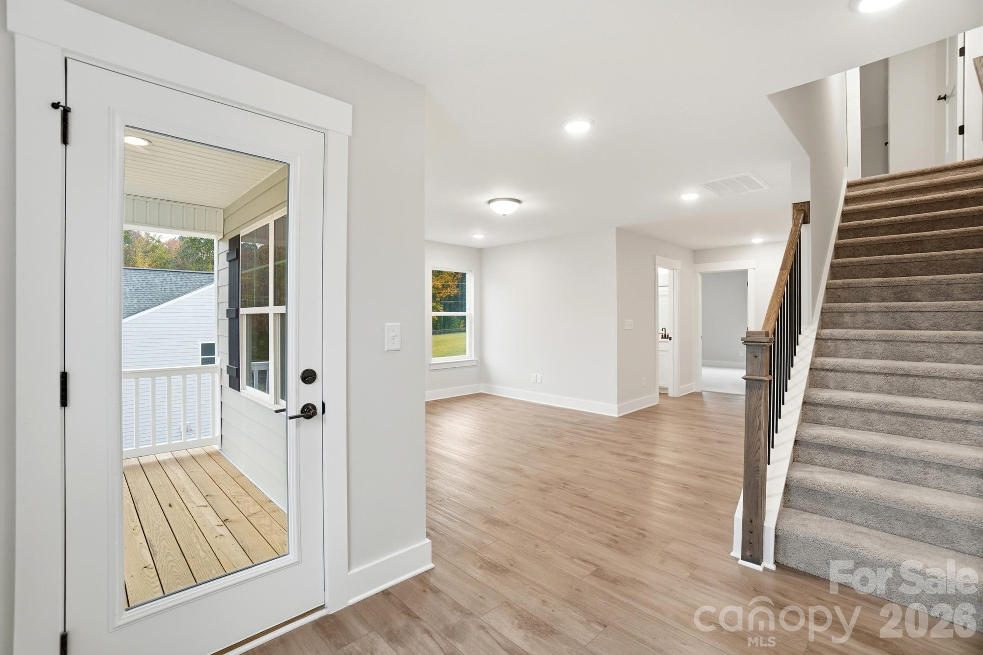 111 Longwood Road Mooresville, NC 28115 - Photo 37 of 47 a view of a hallway with wooden floor and staircase