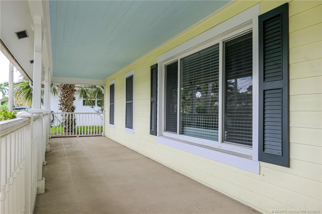 18014 Perigon Way Jupiter, FL 33458 - Photo 8 of 34 a view of a porch with wooden floor and stairs