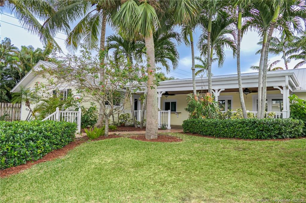 18014 Perigon Way Jupiter, FL 33458 - Photo 10 of 34 a front view of a house with a garden