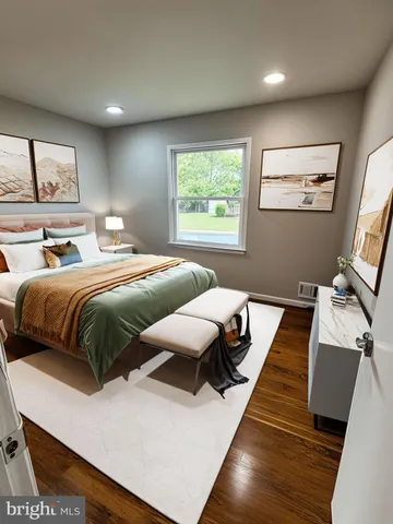 a bedroom with two beds and a large window