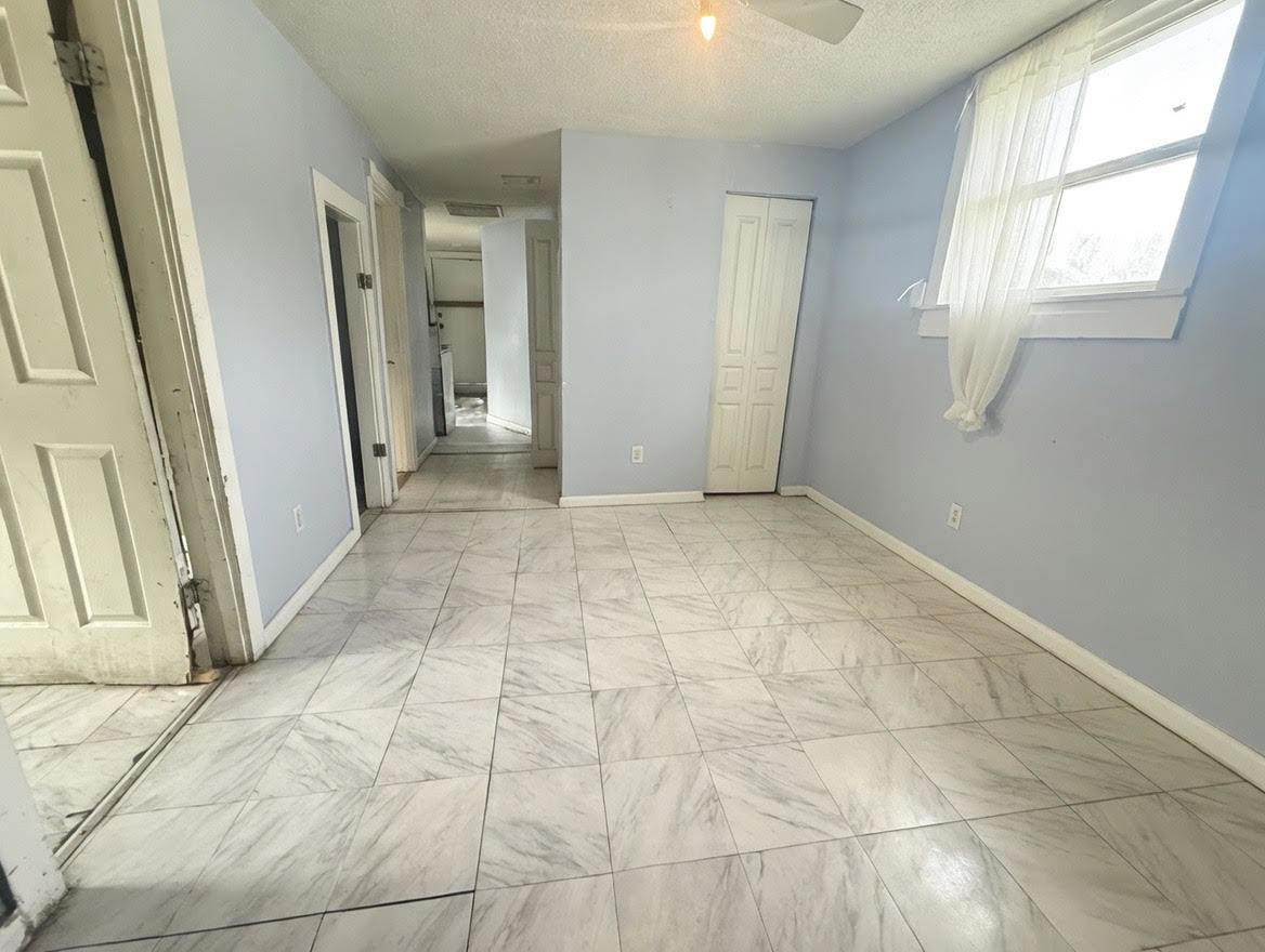 7316 South Perry Avenue Chicago, IL 60621 - Photo 8 of 13 a view of an empty room and window
