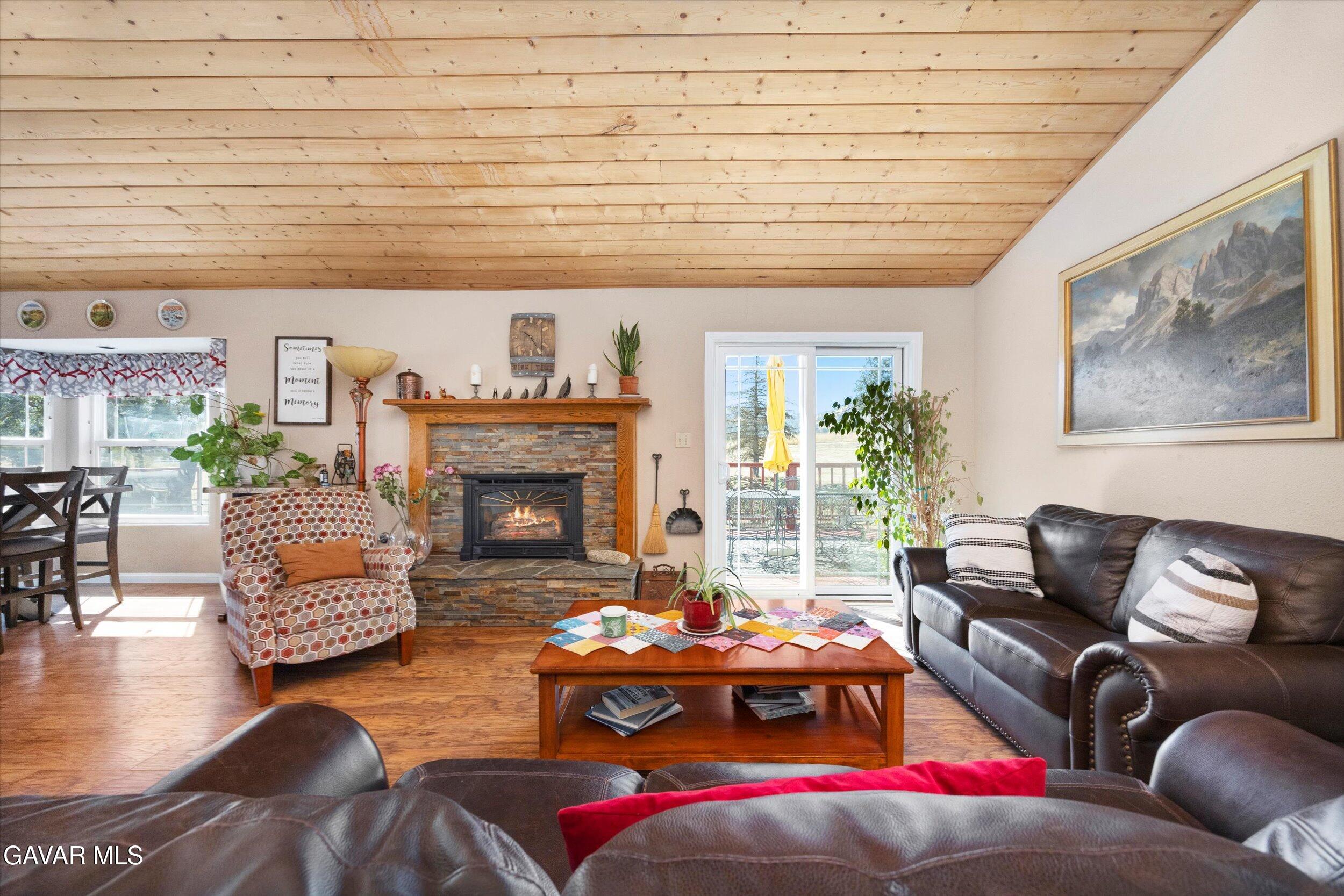28360 Burning Tree Drive Tehachapi, CA 93561 - Photo 16 of 61 a living room with furniture and a fireplace