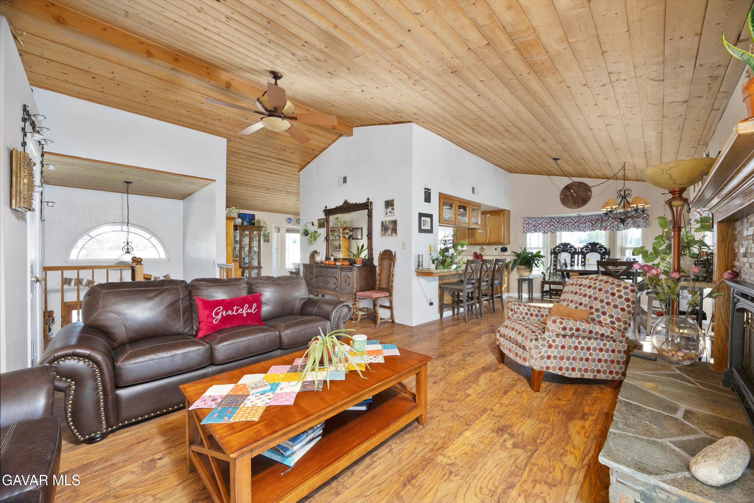 28360 Burning Tree Drive Tehachapi, CA 93561 - Photo 17 of 61 a living room with furniture and wooden floor