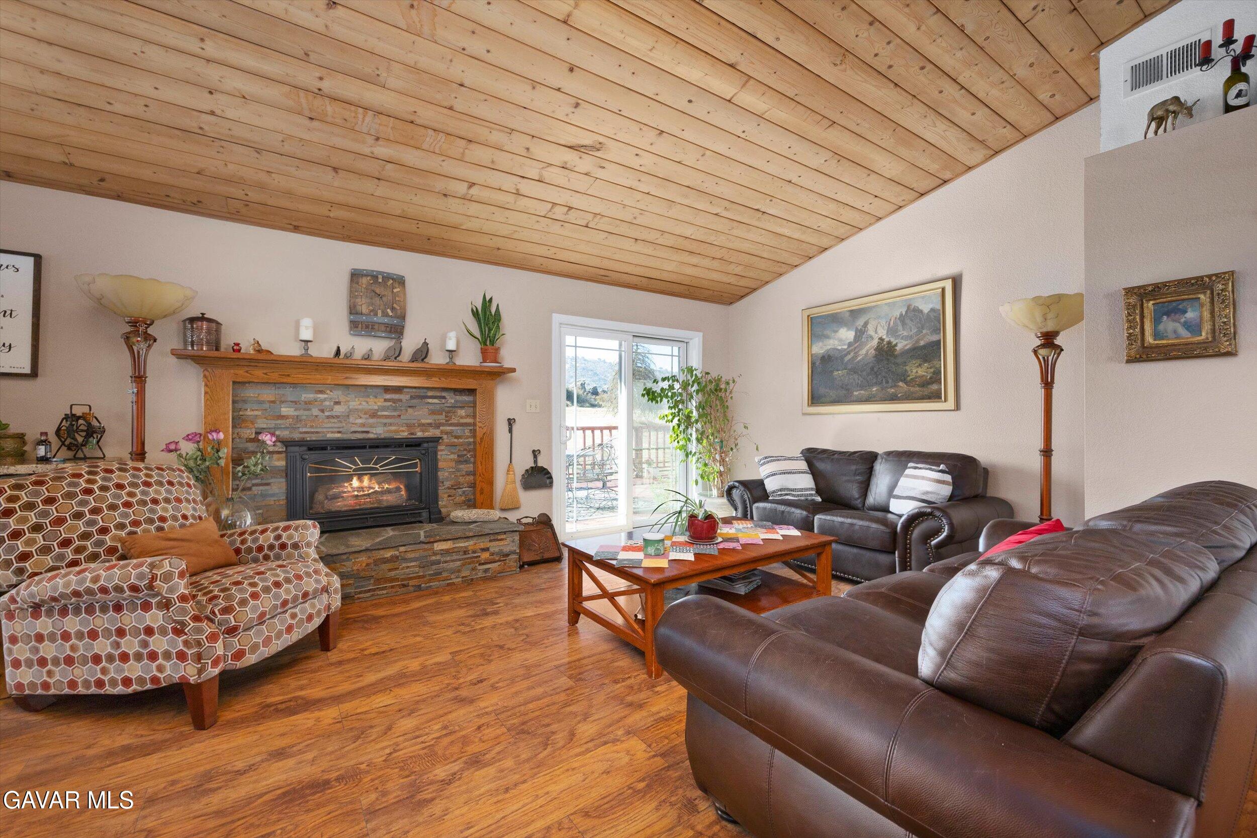 28360 Burning Tree Drive Tehachapi, CA 93561 - Photo 18 of 61 a living room with furniture and a fireplace