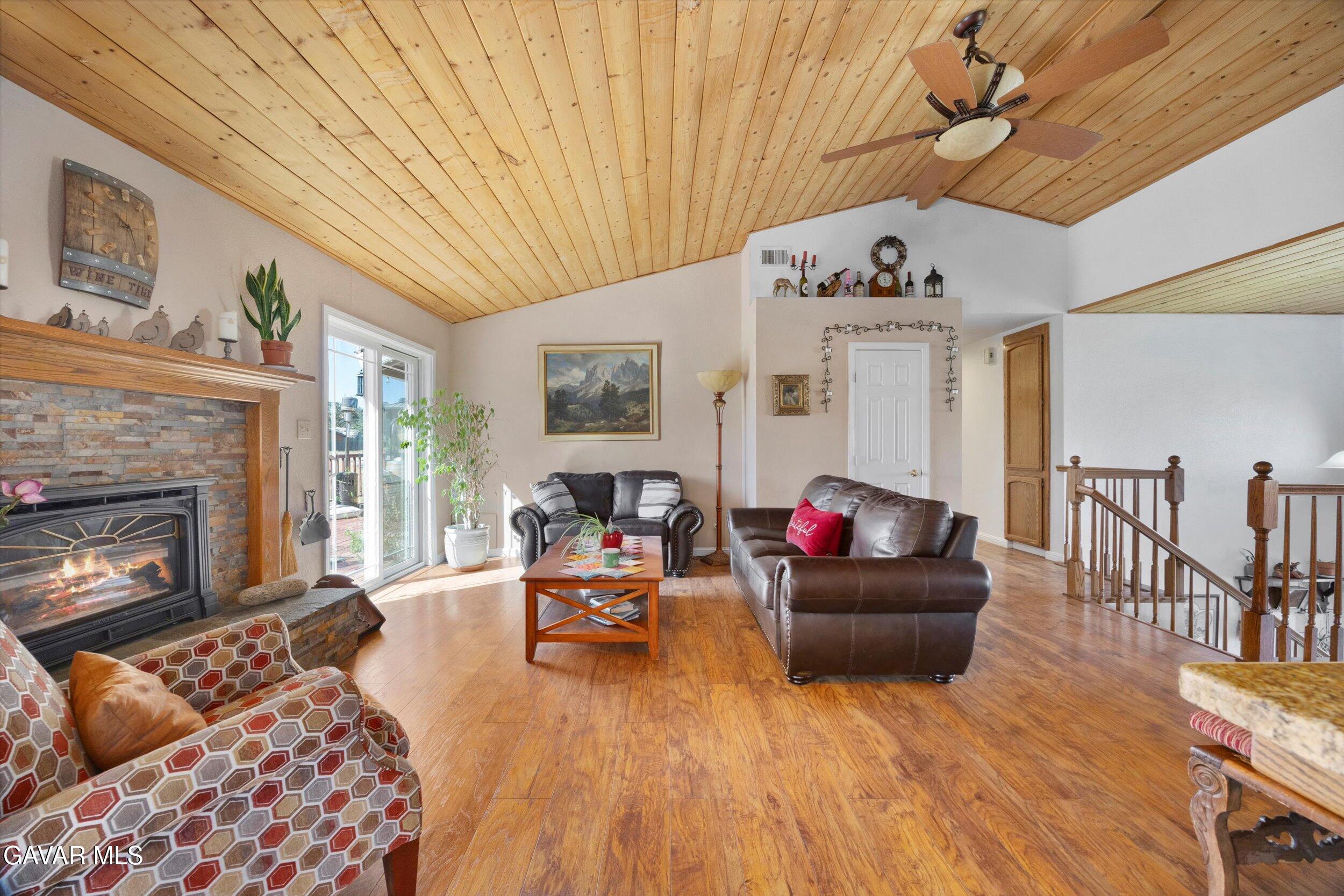 28360 Burning Tree Drive Tehachapi, CA 93561 - Photo 19 of 61 a living room with furniture and a fireplace