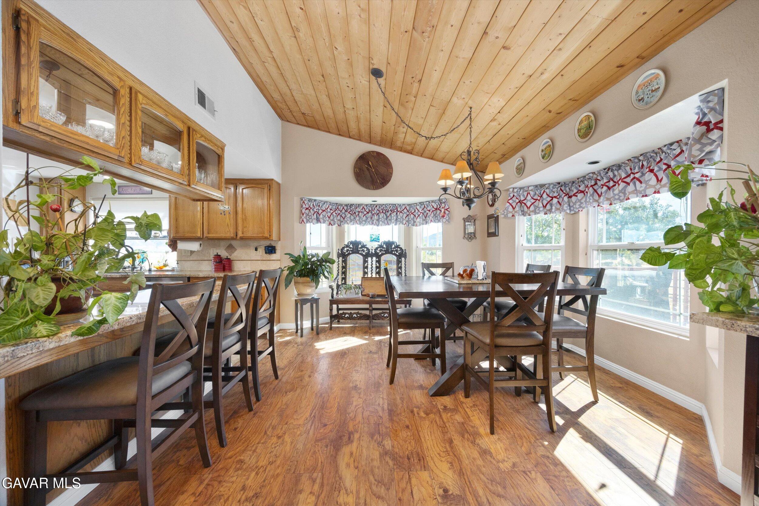 28360 Burning Tree Drive Tehachapi, CA 93561 - Photo 22 of 61 a view of a dining room with furniture window and wooden floor