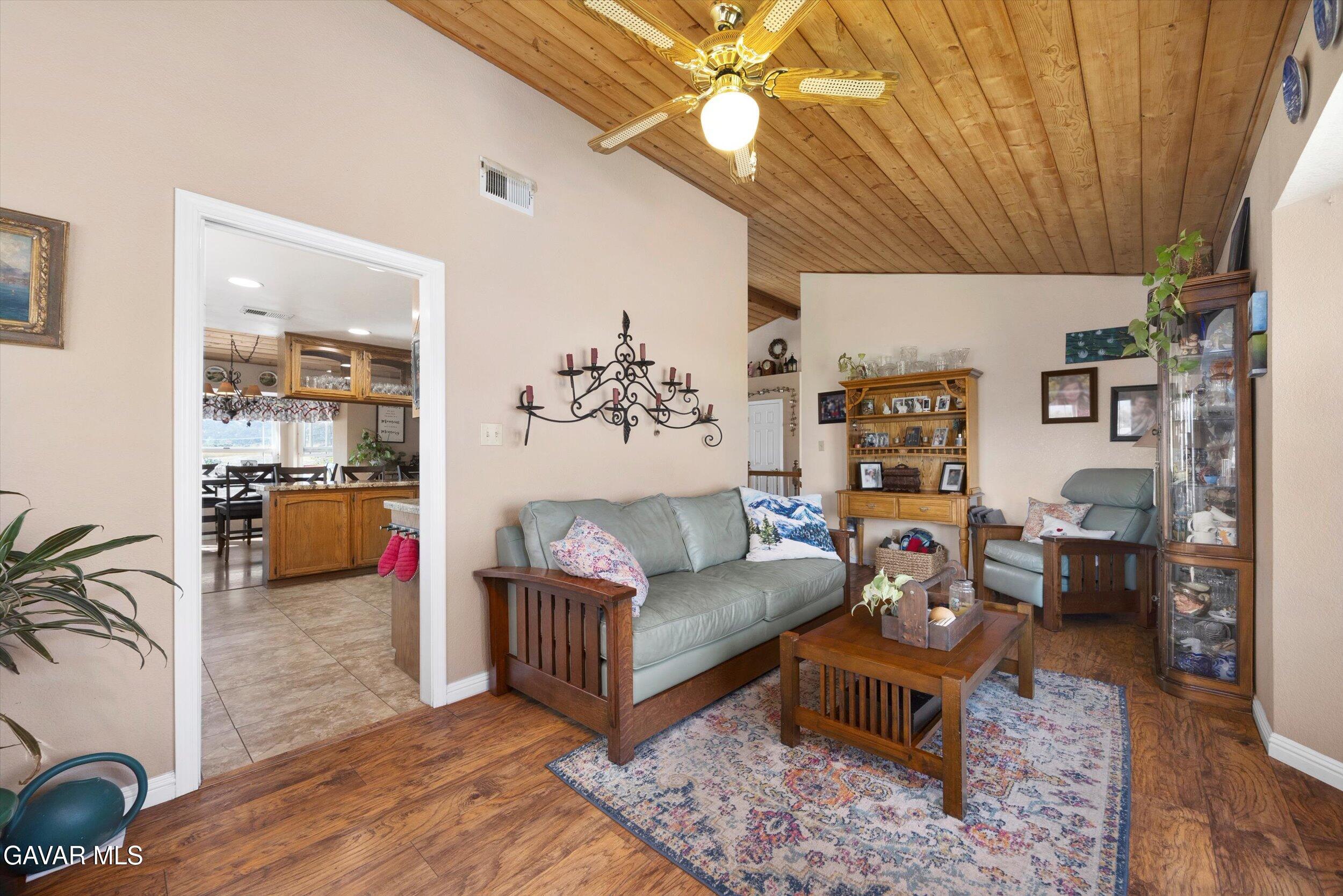 28360 Burning Tree Drive Tehachapi, CA 93561 - Photo 31 of 61 a living room with furniture and a large window