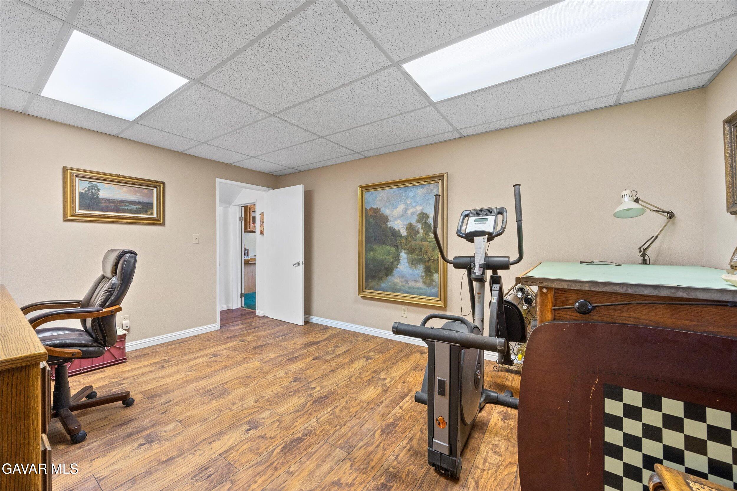 28360 Burning Tree Drive Tehachapi, CA 93561 - Photo 41 of 61 a bedroom with a bed and a window