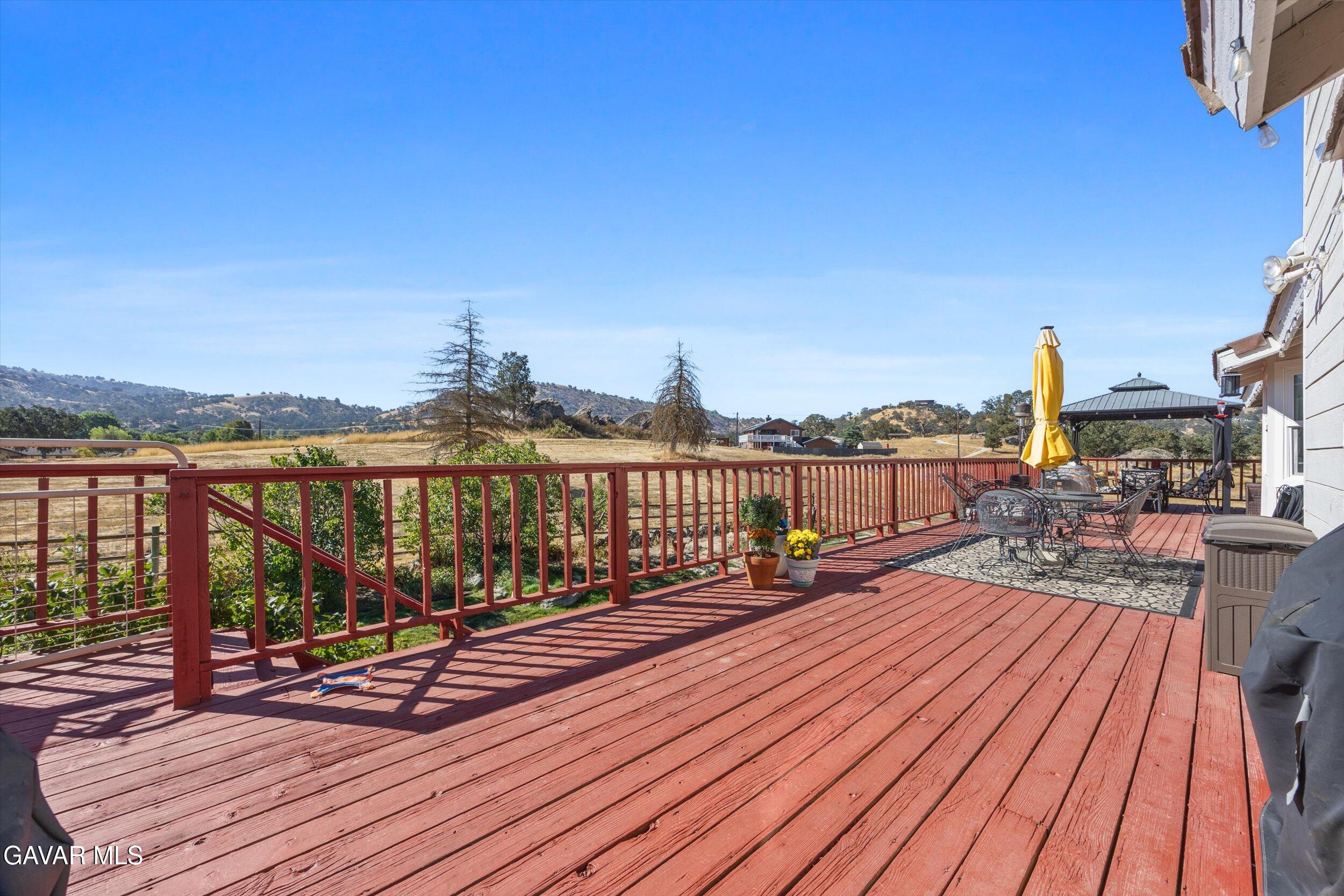 28360 Burning Tree Drive Tehachapi, CA 93561 - Photo 52 of 61 a view of wooden floor with a table and chairs