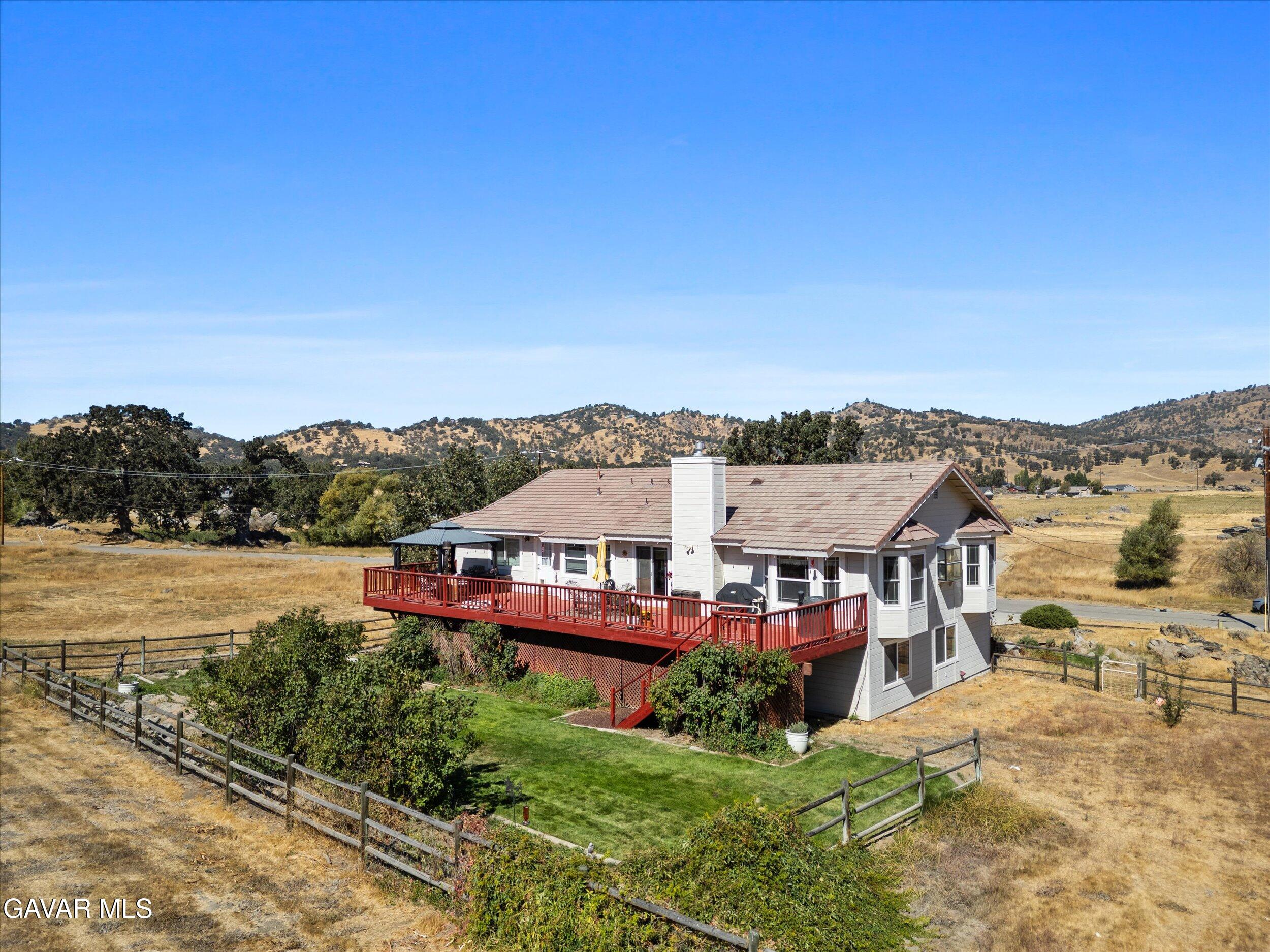 28360 Burning Tree Drive Tehachapi, CA 93561 - Photo 8 of 61 a view of a lake with a mountain in the background