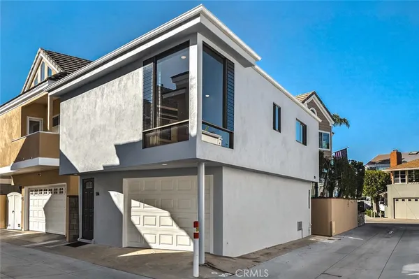 a front view of a house with large windows