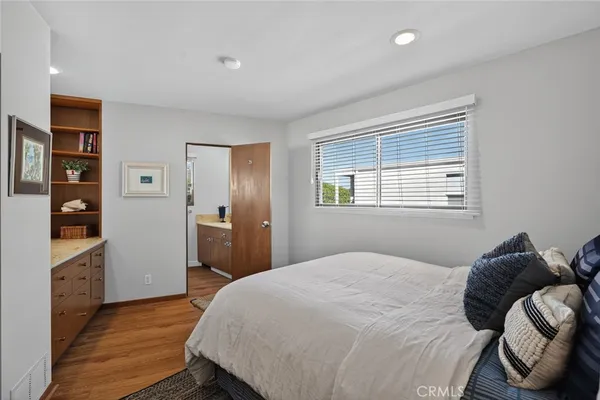 a bedroom with a large bed and a closet