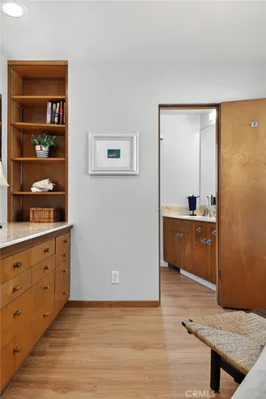 a view of cabinets and wooden floor