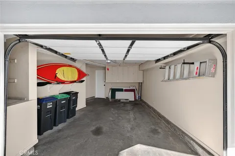 a living room with furniture and a lamp