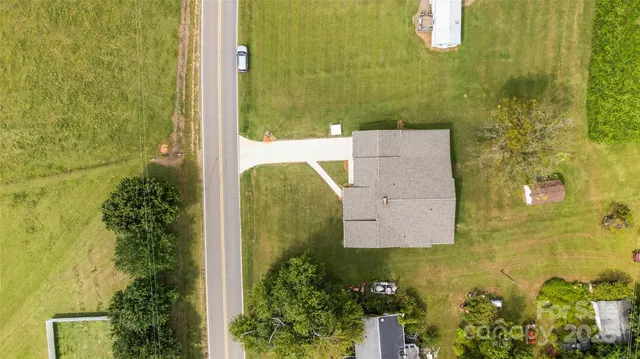 an aerial view of ocean residential house with outdoor space and trees around